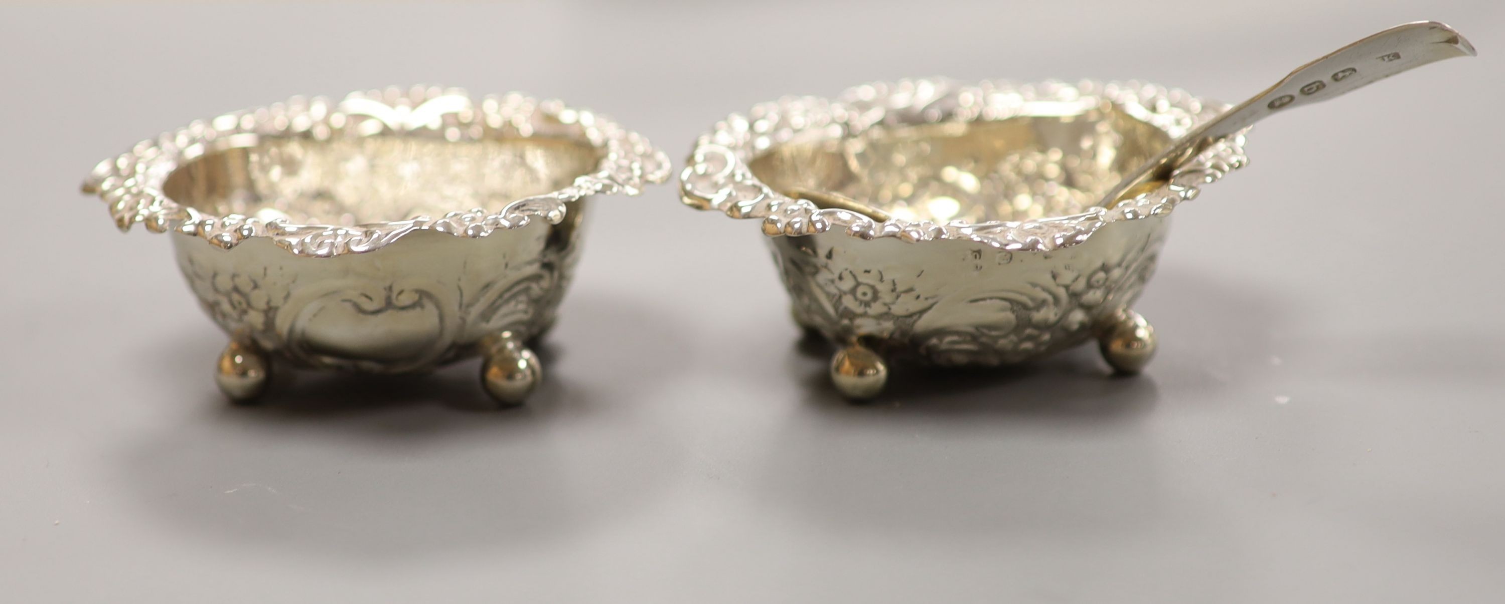 A silver cigarette case, Georgian silver caddy spoon, London, 1817, a pair of silver salts, etc.